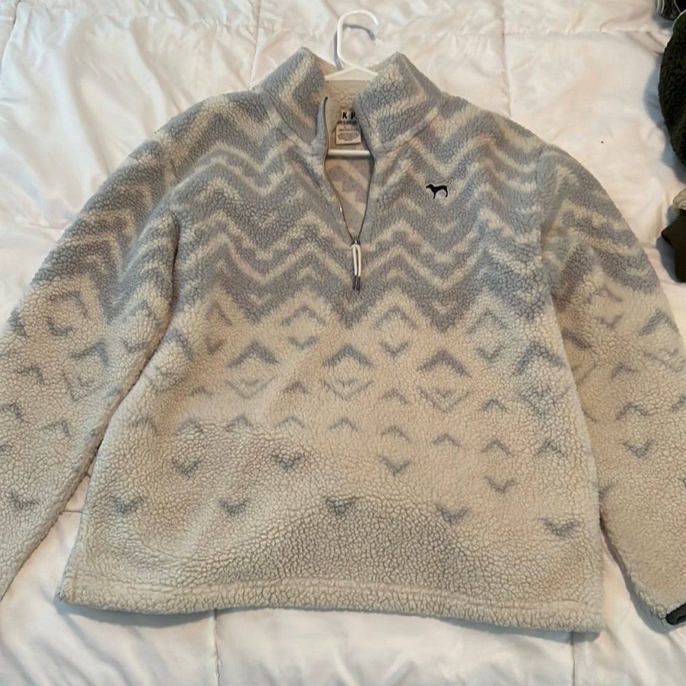 Blue and white pattern, fleece, teddy pullover with zipper and two pockets.